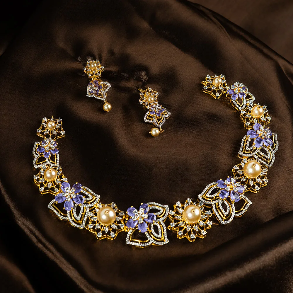 Hiranya necklace and earrings in 92.5 silver set with emerald green stones